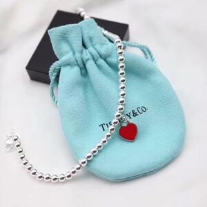 Tiffany & Co. Silver Bracelet with Red Heart Charm